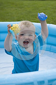 Child paddling in the pool