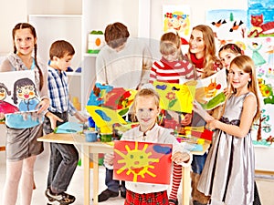 Child painting at art school.