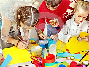 Child painting at art school.