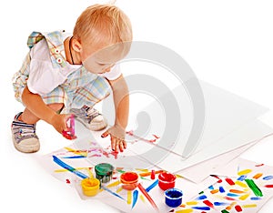 Child painting by finger paint.