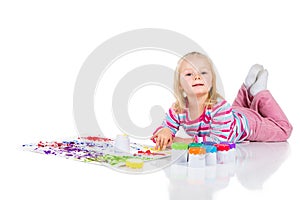 Child painting with fingers