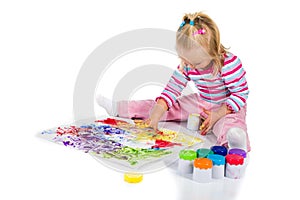 Child painting with fingers