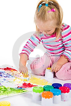 Child painting with fingers