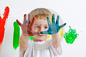 Child painting with messy hands