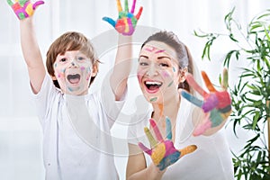 Child painting with mum