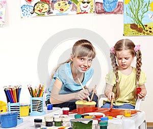 Child painting in preschool.