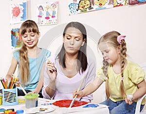 Child painting in preschool.