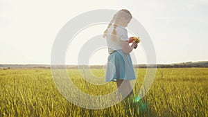 child in the park. little girl picking flowers in lifestyle a field in the park. happy family kid dream concept. allergy