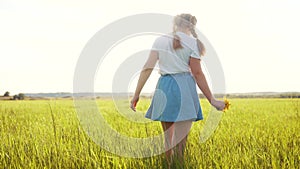 child in the park. little lifestyle girl picking flowers in a field in the park. happy family kid dream concept. allergy
