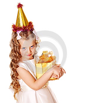 Child in party hat with gold gift box .