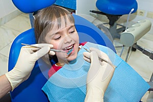 A child patient at the dentistÃ¢â¬â¢s consultation photo