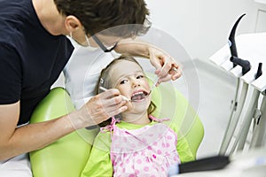 Child patient on her regular dental checkup