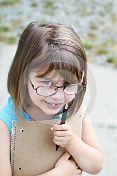 Child with Pen and Book