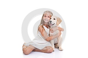 Child with pet puppy dog
