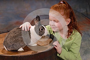 Child with Pet Rabbit photo