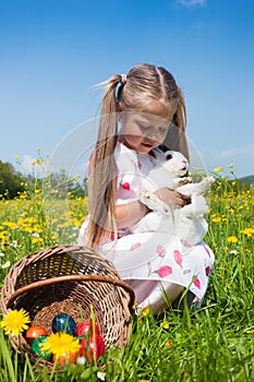 Child petting Easter bunny