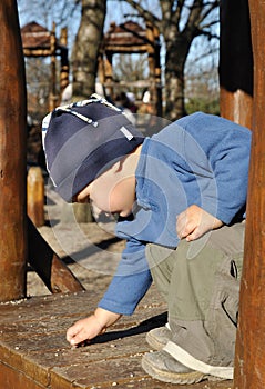 Child picking small stones