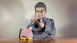 Child, piggy bank and key to success, research and due diligence early education in finances and wealth growth