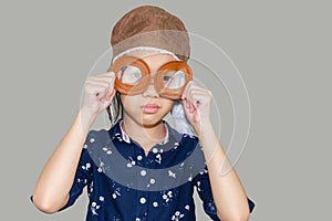 Child pilot aviator with clipping path on gray background, Happy kid playing concept