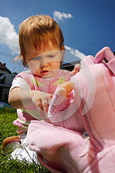 Child with pink rucksack