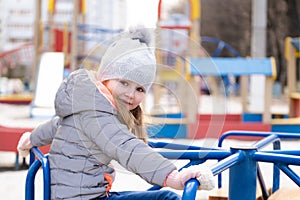 Child plating at playground toys
