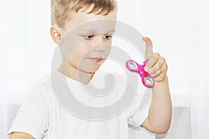 Child play with fidget spinner stress relieving popular toy