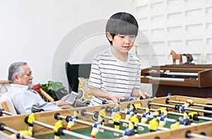 Child play football game board at home