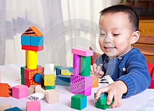 Child play with wooden blocks