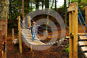 Child on playground bridge