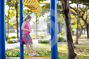 Child on playground. Kids play outdoor