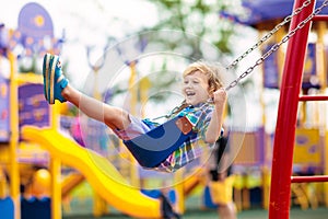 Child on playground. Kids play outdoor