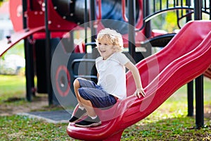 Child on playground. Kids play outdoor