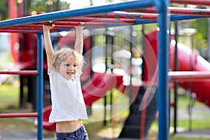 Child on playground. Kids play outdoor