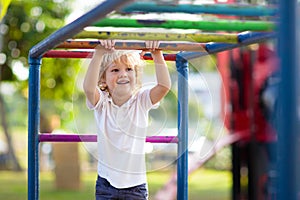 Child on playground. Kids play outdoor