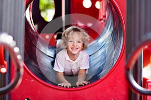Child on playground. Kids play outdoor