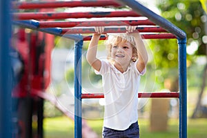 Child on playground. Kids play outdoor