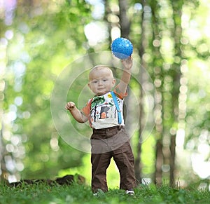 Child playing with ball in park