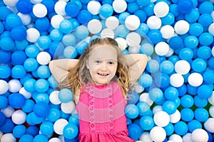 Kids play in ball pit. Child playing in balls pool