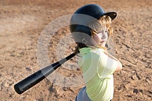 Child playing Baseball. Batter in youth league getting a hit. Boy kid hitting a baseball.