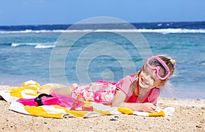 Child playing on beach.