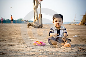 Child Playing At The Beach