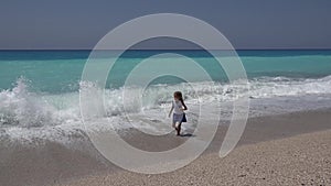 Child Playing on Beach, Kid in Sea Waves, Girl Running on Coastline in Summer