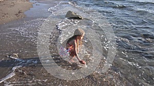 Child Playing on Beach, Kid Walking Running in Sea Waves on Seashore, Girl Watching Sunset on Coastline Shore in Summer Vacation