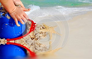 Child Playing in Beach Sand