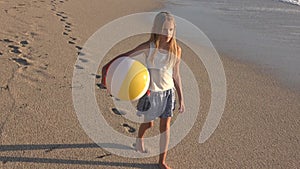 Child Playing on Beach at Sunset, Happy Kid Walking in Sea Waves Girl on Seaside