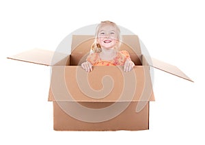 Child playing in a box