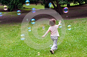 Child playing with bubbles