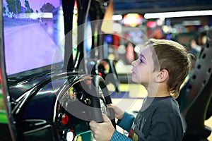 Child playing in car simulator