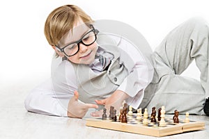 Child Playing Chess, Smart Kid Boy in Business Suit Glasses Play