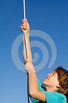 Child playing climbing rope